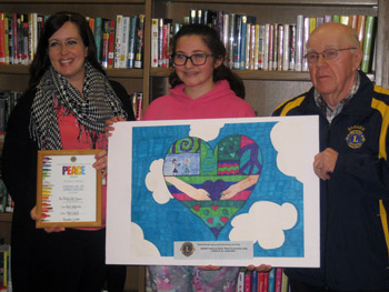 Natalie Brandel holding her winning entry in the Barker Lions Peace Poster Contest