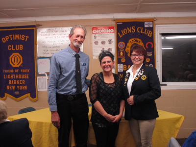 Lion President Tom Ware, new member Lisa Quiett and DG Regina Cecconi.